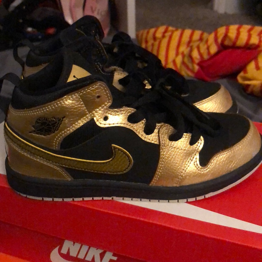 Kids size 2 gold and black Jordan’s